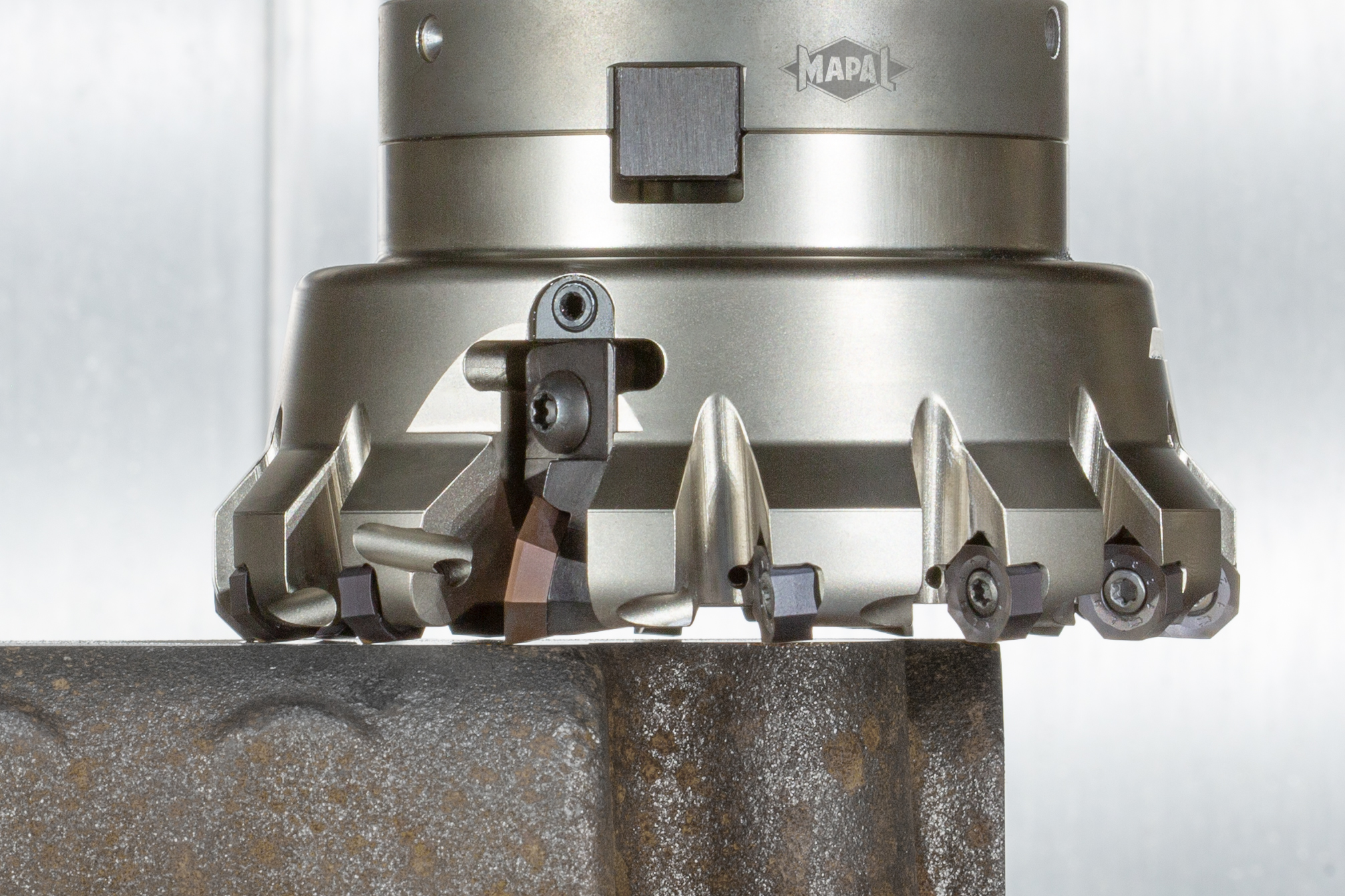 The image shows the NeoMill 16 Finish milling cutter machining a cast component.